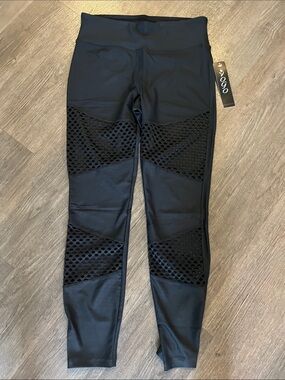 Black leggings with netting detail. M